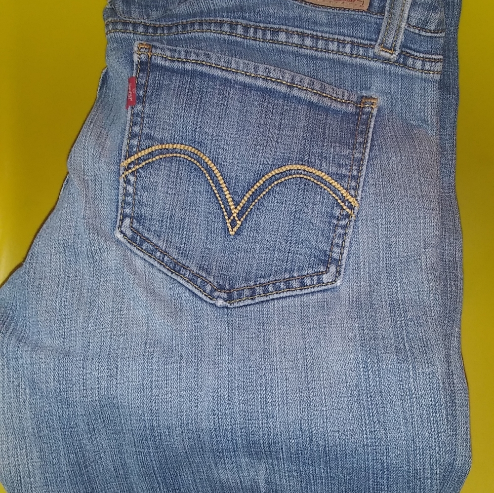 Levis 524 too super low distressed jeans